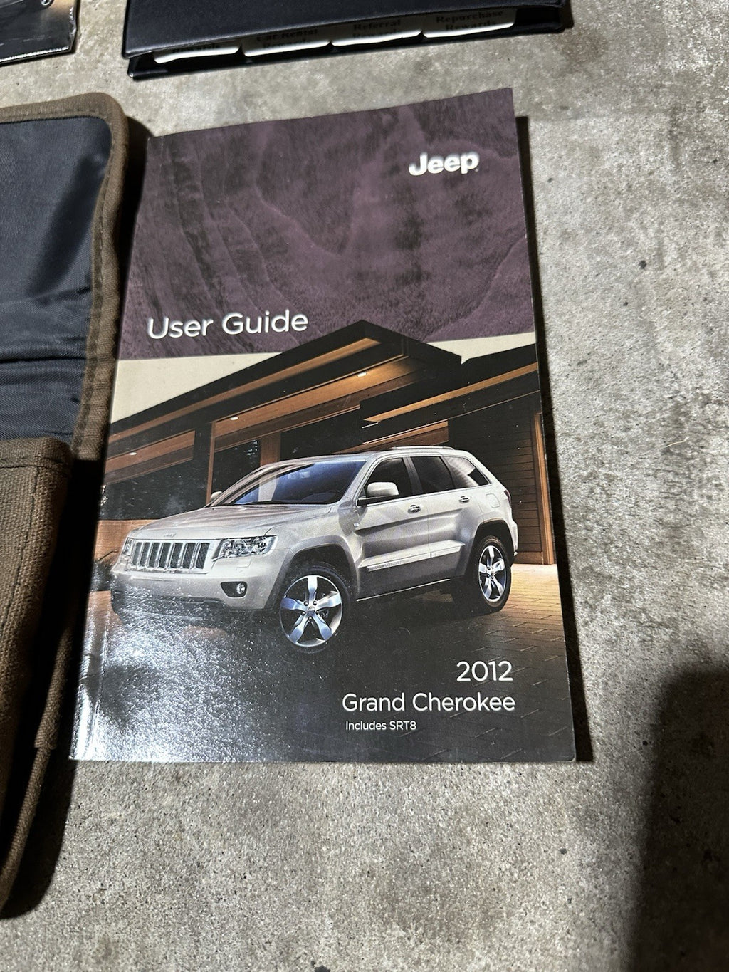 2012 Jeep Grand Cherokee Owners Manual with supplements, DVD and case